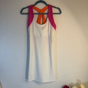 Head golf or tennis dress in white with pink and orange accents. Women’s Size M